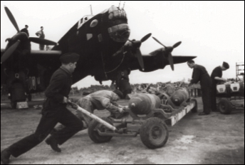 Halifax bomber being loaded, 405 Squadron, RCAF, c. 1944. - IWM CH 6609