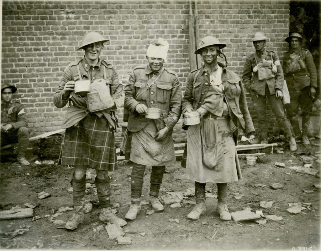 Three Wounded Canadians on Battlefield