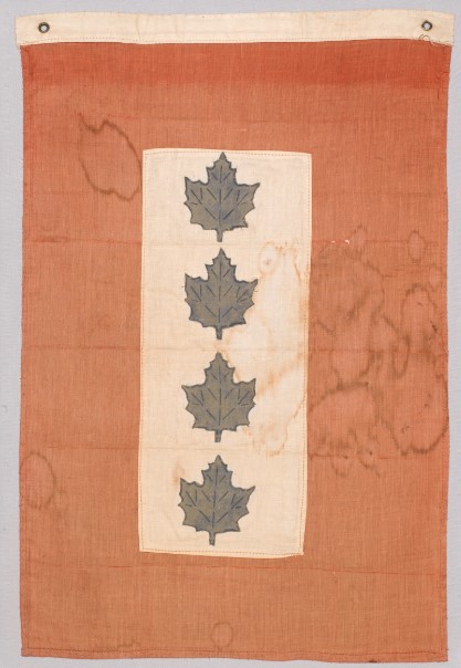 Faded flag with four maple leaves in a row