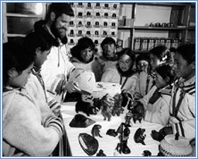 James Houston with Inuit children, 1953. Indian and Northern Affairs Canada