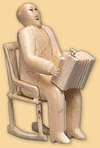 Man in Rocking Chair Playing Concertina Man in Rocking Chair Playing Concertina