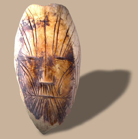 Miniature ivory mask representing a human face, Dorset, Devon Island, Nunavut, circa 1700 B.C., © CMC/MCC, QkHn-13489