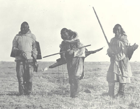 Three Copper Inuit men with fish near Bernard Harbour, Northwest Territories (Nunavut), © CMC/MCC, R.M. Anderson, 51002