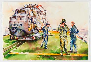 Colin Peek Standing in Front of the Sea-King Helicopter in His Gear
