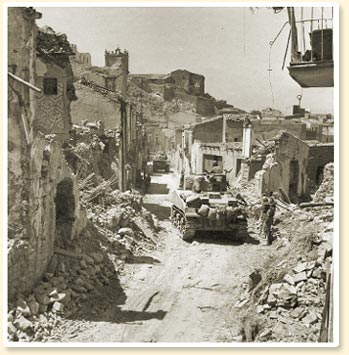 The ruins of Regalbuto: Tanks of the three rivers regiment in the town which was so hotly disputed in August, 1943. - Photo Credit:Canadian Military Photograph No. 22667, CWM Reference Photo Collection