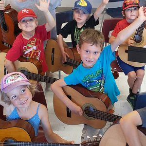 Children playing guitars