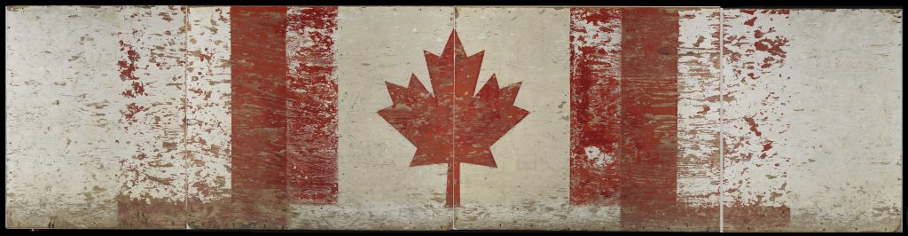 A scuffed wooden panel decorated with a Canadian flag