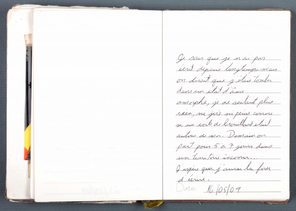 A well-worn diary with handwritten entries