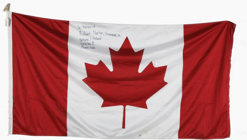 A Canadian flag with handwritten text