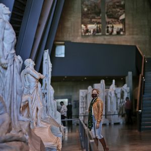 A person is looking at sculptures.