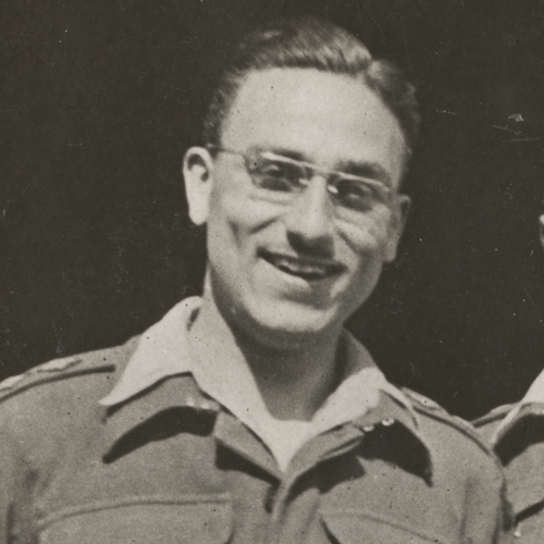 Two men in military uniforms smiling for the camera at the Canadian War Museum in Ottawa.