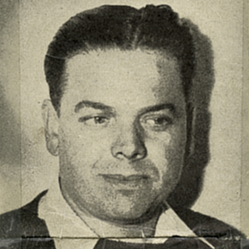 A black and white photo of a man in a suit at the Canadian War Museum in Ottawa.