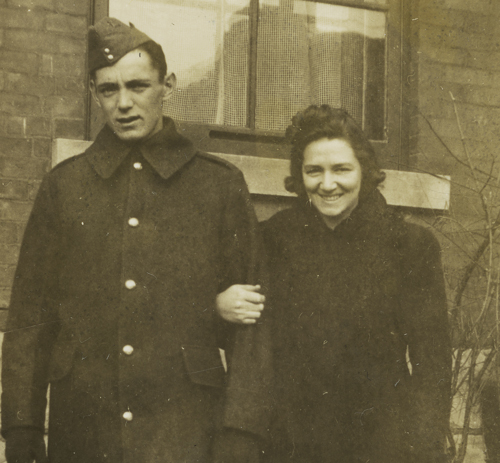 A man and woman standing next to each other at the Canadian War Museum in Ottawa.