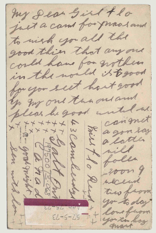 The back of a post card filled with handwriting in pencil.