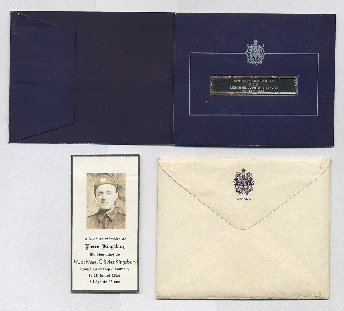 Grouping of three objects: purple card with memorial bar, card with soldier’s image and details, and envelope with coat of arms.