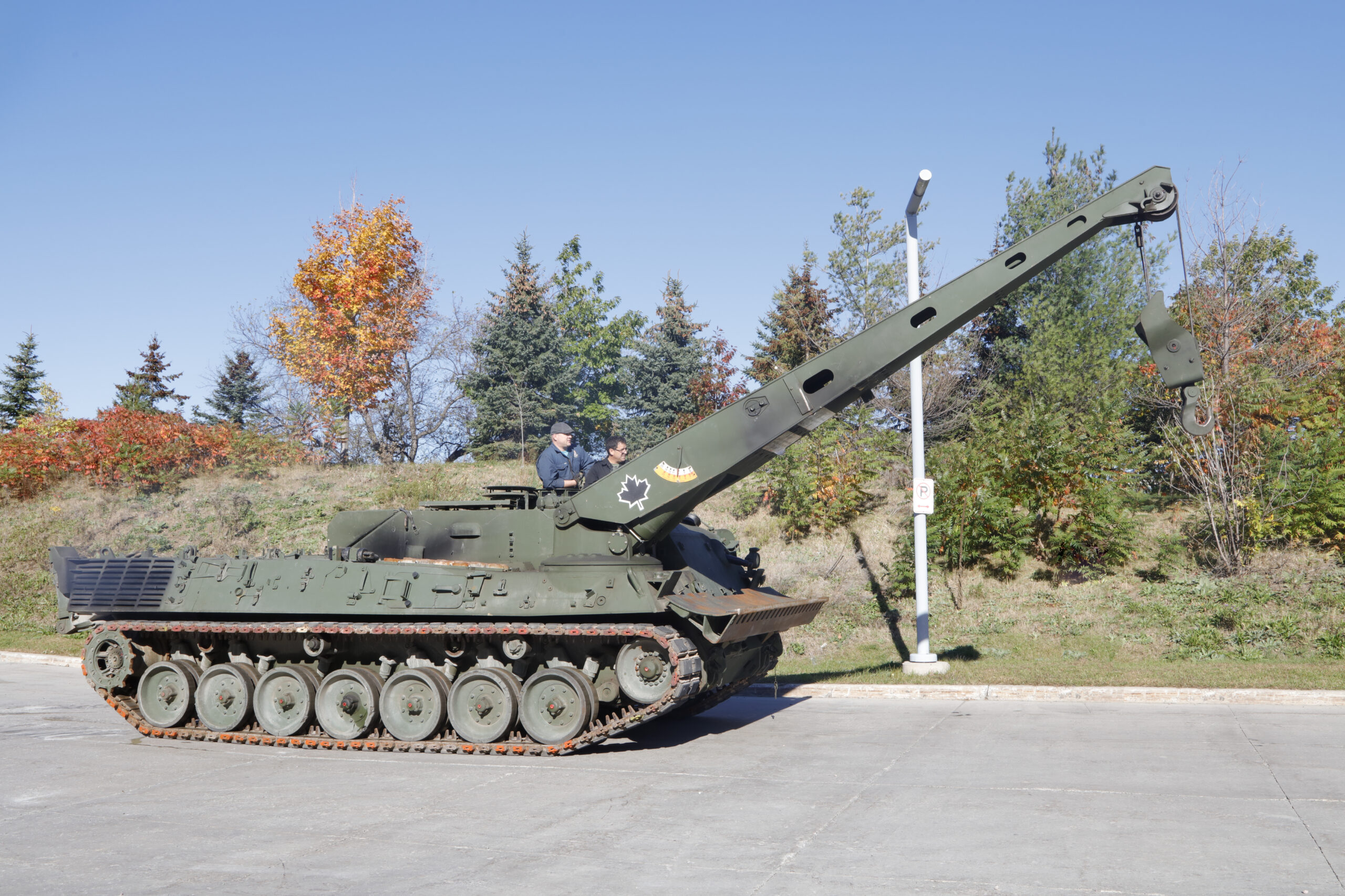 A long, tracked armoured vehicle with a crane on top.