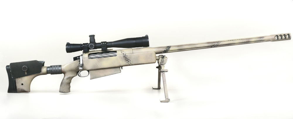 A white-and-grey rifle with a pistol grip and a long black scope, propped up on a short bipod.